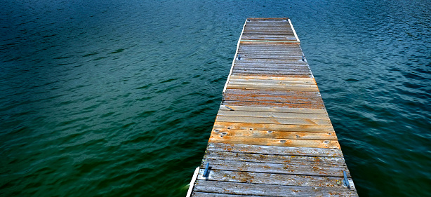 Old Wooden Dock with water shoreline
