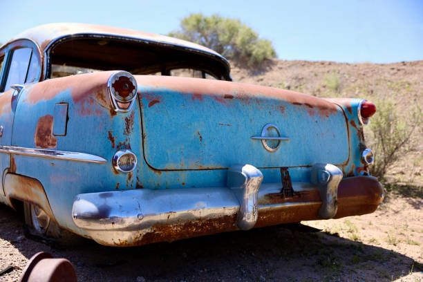 istock Mid century auto in a desert junkyard 2149133820