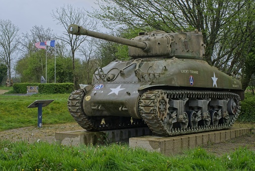 Side view of tank at Kingston Military College parked on the grass during day of springtime