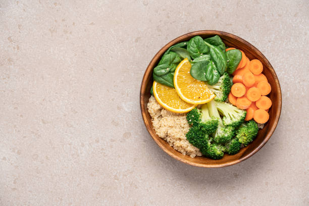 istock Buddha bowl salad with broccoli, spinach, quinoa and carrots top view 2149134900