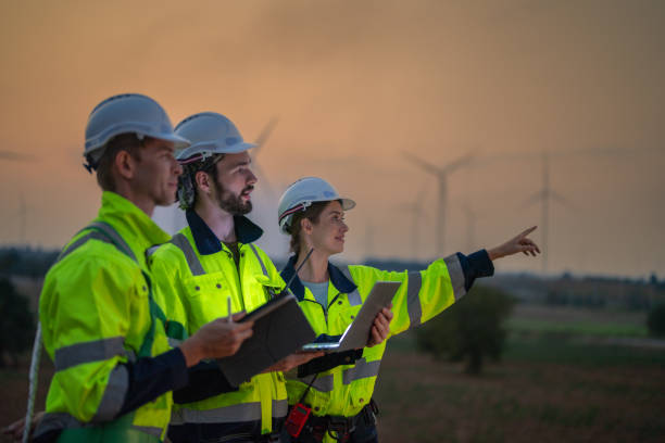 istock Team Engineers men and woman checking and inspecting on construction with sunset sky. people operation. Wind turbine for electrical of clean energy and environment. Industrial of sustainable. 2149135237