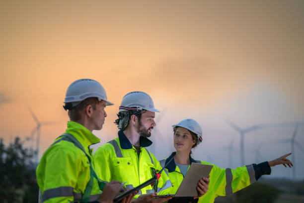 istock Team Engineers men and woman checking and inspecting on construction with sunset sky. people operation. Wind turbine for electrical of clean energy and environment. Industrial of sustainable. 2149135928