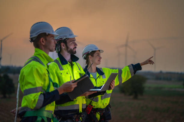 istock Team Engineers men and woman checking and inspecting on construction with sunset sky. people operation. Wind turbine for electrical of clean energy and environment. Industrial of sustainable. 2149136544