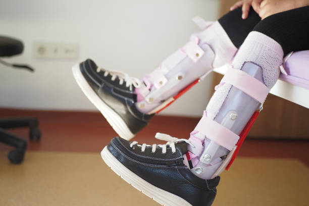 istock Child cerebral palsy disability, legs orthosis. 2149136981