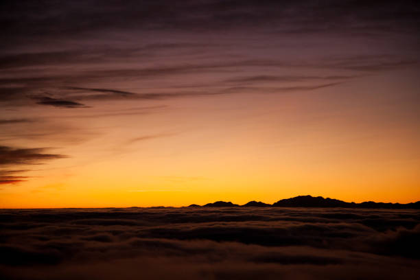 Spectacular sunset over a sea of clouds. Beautiful landscape
