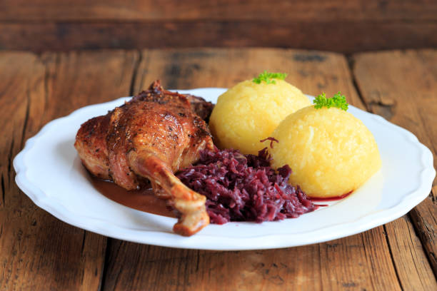 Leg of goose with red cabbage and dumplings