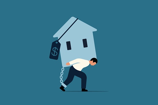 Real Estate Crisis Concept. Overpaying in Real Estate and House Mortgages. Stressed Office Worker Carrying House with Expensive Price Tag. Vector Business Illustration