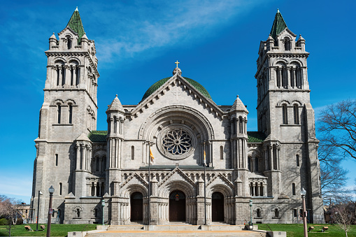 Front facade of the Basilica of the National Shrine of the Immaculate Conception, a Catholic church in Washington, DC in autumn