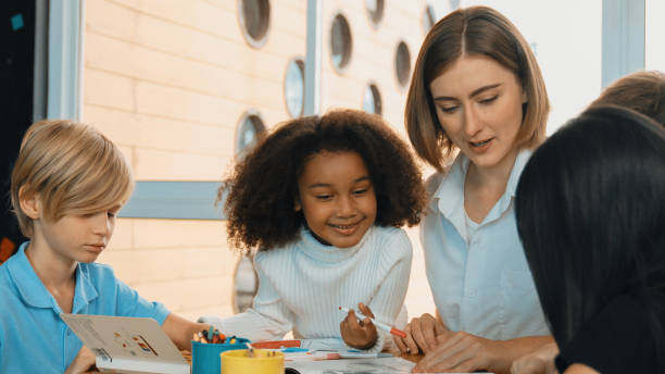 istock Happy student and smart teacher drawing and coloring by using marker. Erudition. 2149139628
