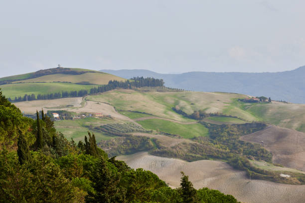 Hilly landscape of Montefeltro against partly cloudy sky