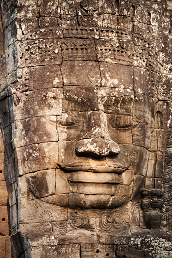 Stone Faces at Bayon Temple. Bayon is a well known khmer temple at Angkor in Cambodia.