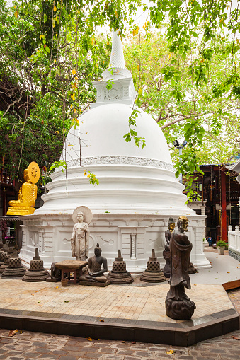 White Stupa at the Gangaramaya Temple in Colombo, Sri Lanka. Gangaramaya Temple is a buddhist temple with eclectic mix of Sri Lankan, Thai, Indian, and Chinese architecture.