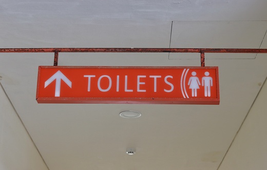 The board displays a toilet on an orange background