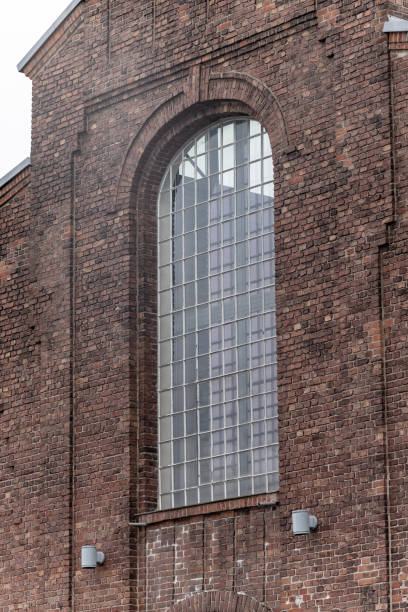 istock old window in a brick wall of an industrial old buiding 2149140919