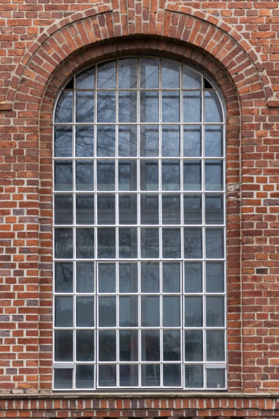 istock old window in a brick wall of an industrial old buiding 2149140920