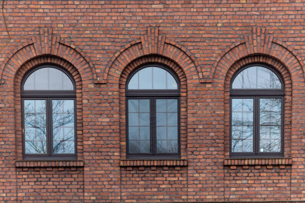 istock old window in a brick wall of an industrial old buiding 2149140930