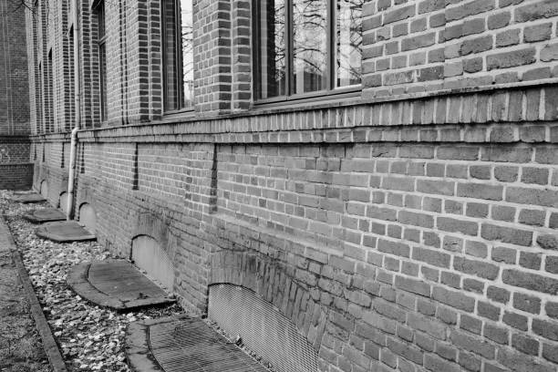 istock old window in a brick wall of an industrial old buiding 2149141120