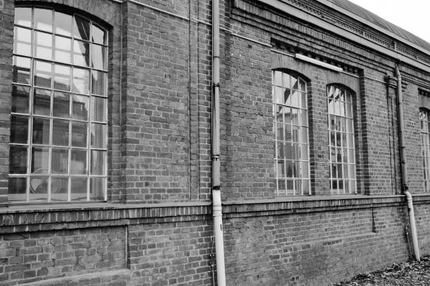 istock old window in a brick wall of an industrial old buiding 2149141209