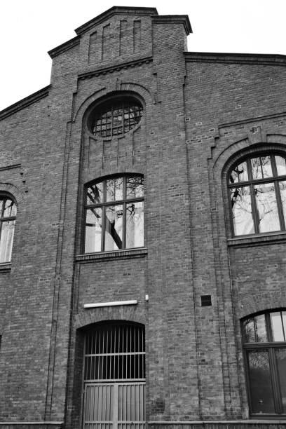 istock old window in a brick wall of an industrial old buiding 2149141227