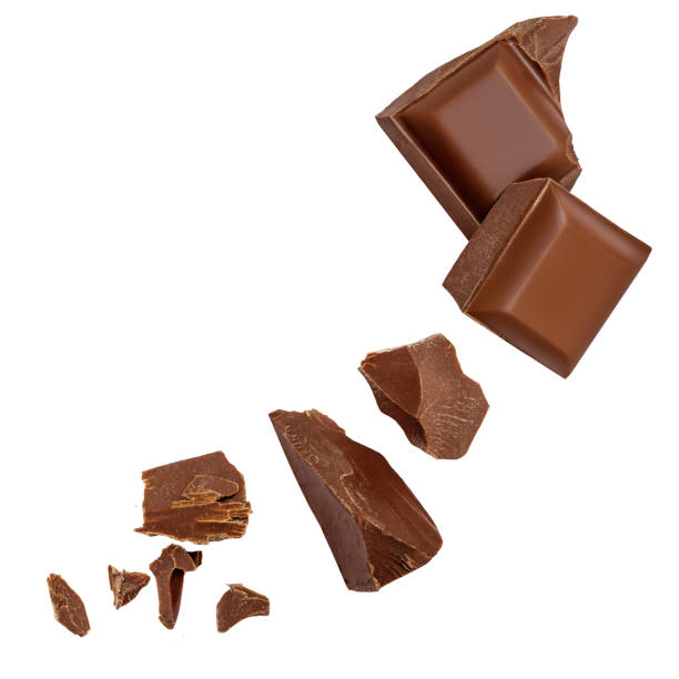 istock  Levitating milk chocolate chunks isolated on white background. Crumbs, shavings and Flying Chocolate pieces Top view. Flat lay 2149141838
