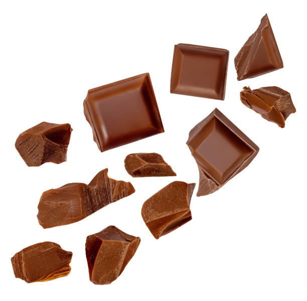 istock  Levitating milk chocolate chunks isolated on white background. Crumbs, shavings and Flying Chocolate pieces Top view. Flat lay 2149141841