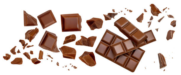 istock  Levitating milk chocolate chunks isolated on white background. Crumbs, shavings and Flying Chocolate pieces Top view. Flat lay 2149141852