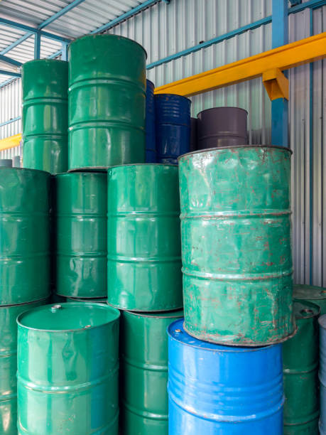 istock Many oil barrels are stored in the warehouse. 2149143016