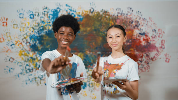 istock Student with mixed races smile and look at camera at art lesson. Edification. 2149145448