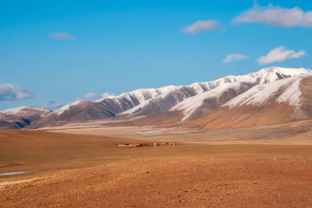 istock landscape of a wide prairie valley with a mountain range covered with snow 2149146596