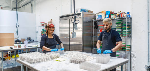 istock Two chocolatiers working at the chocolate factory 2149146633