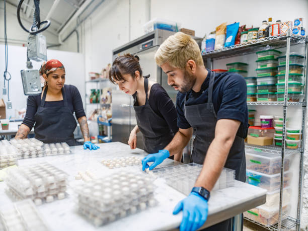istock Chocolatiers working at the chocolate factory 2149146671
