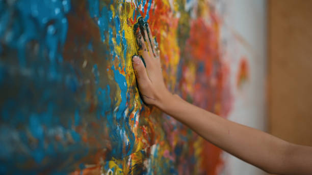 Side view of girl hand placed at stained wall and remove the hand. Edification.