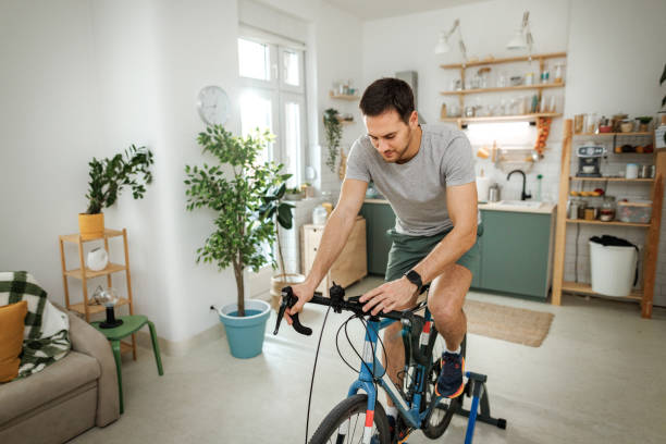istock Handsome man doing bike workout at home 2149147185