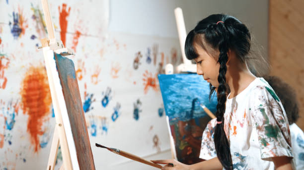 istock Student painted or draw canvas with diverse friends in art lesson. Erudition. 2149147735