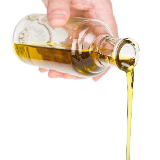 istock Oil pouring from a bottle. 2149148255