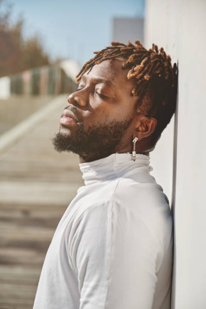 istock Thoughtful brutal black man near wall 2149148610