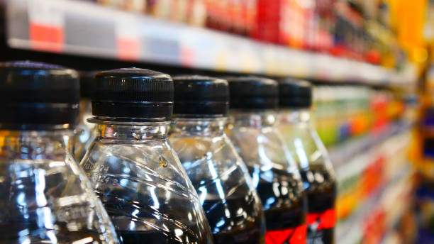 istock Close-up of plastic cola bottles in the drinks department 2149148617