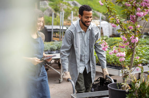 istock Diverse Team Tending to Plants at Nursery 2149151005