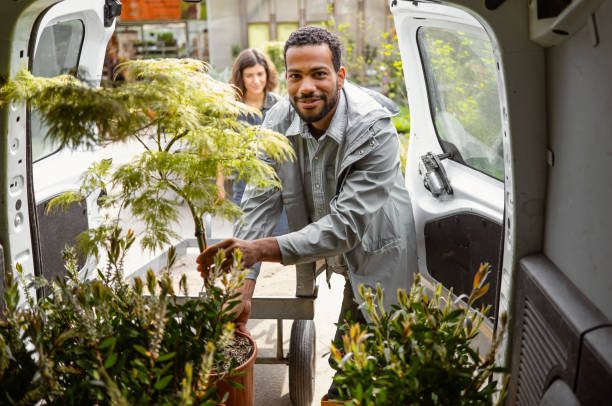 istock Gardeners Preparing Plants for Transport 2149151031