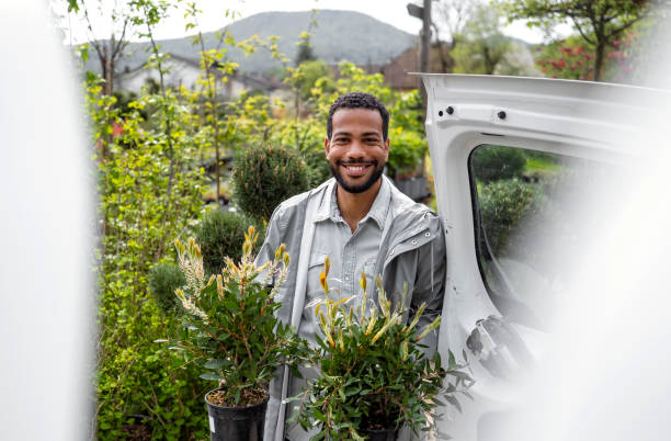 istock Smiling Black Gardener Preparing Plants for Delivery 2149151045