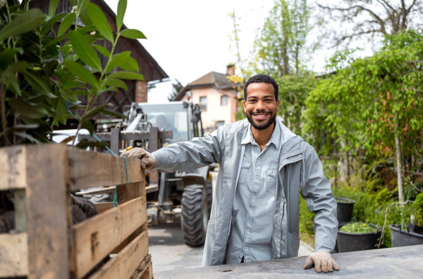 Cheerful Black Gardener Preparing for Plant Delivery