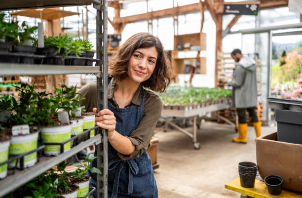 Smiling Female Employee at Plant Nursery