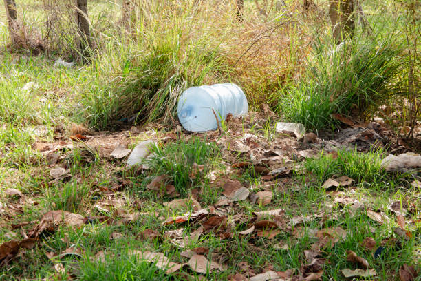 large plastic bottle polluting the environment. waste in the environment.