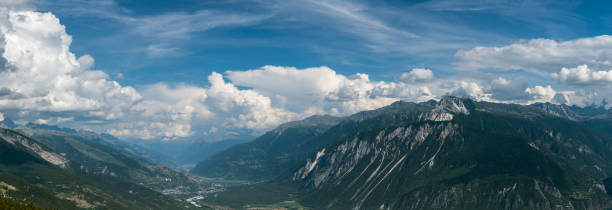 Panoramic view on valley of river Rhone from Crans Montana in Switzerland Crans-Montana, Switzerland - August 11, 2020: Panoramic view on valley of river Rhone from Crans Montana in Switzerland during August 2020 crans montana stock pictures, royalty-free photos & images