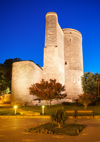 The Maiden Tower at night. It is also known as Giz Galasi and located in the Old City in Baku, Azerbaijan.