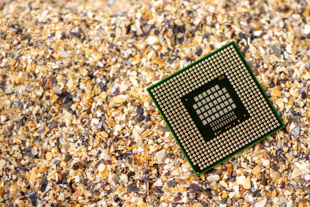 Close-up of a processor with sand in the background