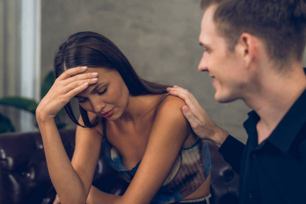 istock Psychiatrist comforting and supporting stressed and depressed patient. Unveiling 2149155050