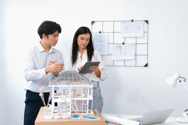istock Manager tells coworker about building detail by using tablet. Immaculate. 2149155252