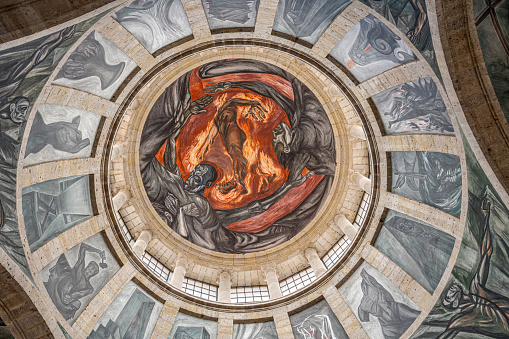 Guadalajara, Mexico - 10-07-2023: Gazing Upon the Magnificent Mural in the dome inside the Hospicio Cabanas building.