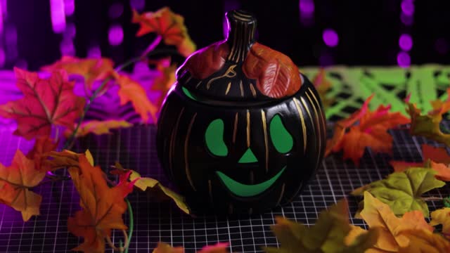 Closeup Smiling pumpkin painted black for Halloween decoration